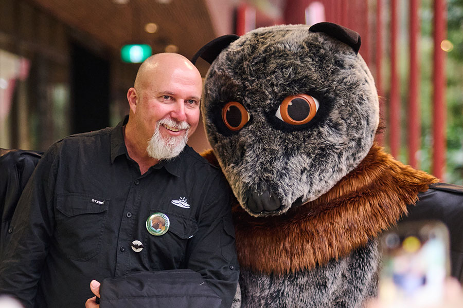 Sunshine Coast Bat Mascot posing for photos with Bat Night Participants 