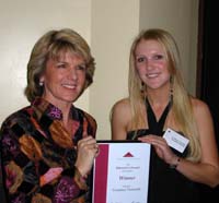 CSU journalism graduate Courtney Trenwith (right) receives her award from Federal Minister for Education, Julie Bishop.