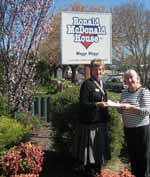 CSU nurse Coleen Pearce (left) hands over money raised by students to Ms Deborah Braines, Manager of Ronald Macdonald House in Wagga Wagga. 