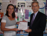 Ms Kathleen Gallagher from the Central West Women's Health Centre in Bathurst receives funds raised at the recent 'Reclaim the Night' march from CSU Vice-Chancellor and President, Professor Ian Goulter.