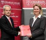 Ms Kristy Robson from the School of Community Health receiving the 2009 Vice-Chancellor&rsquo;s Award for Professional Excellence from the Vice-Chancellor Professor Ian Goulter. 