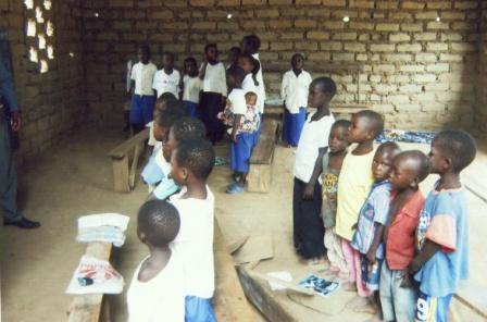 Students ready for lessons in their newly constructed classroom in Korohoro in the Democratic Republic of Congo.