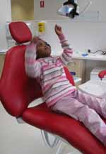 Pre-schooler Aisha from the CSU Children's Centre enjoys the chair during the visit to the CSU Dental and Oral Health Clinic on Thursday 15 July.