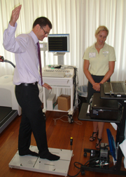 CSU V-C Professor Andrew Vann tests his balance supervised by Dr Suzi Edwards from the School of Human Movement Studies