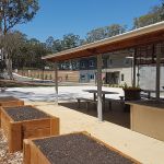 Outdoor BBQ area and planter boxes