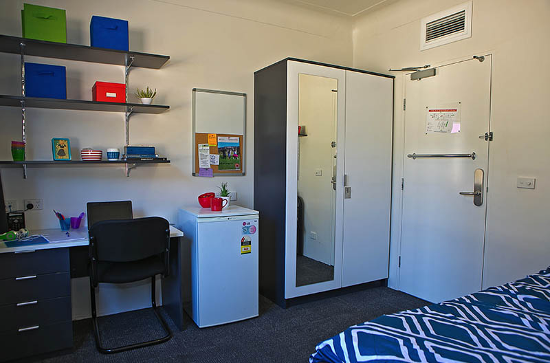 Typical room showing study area and wardrobe storage