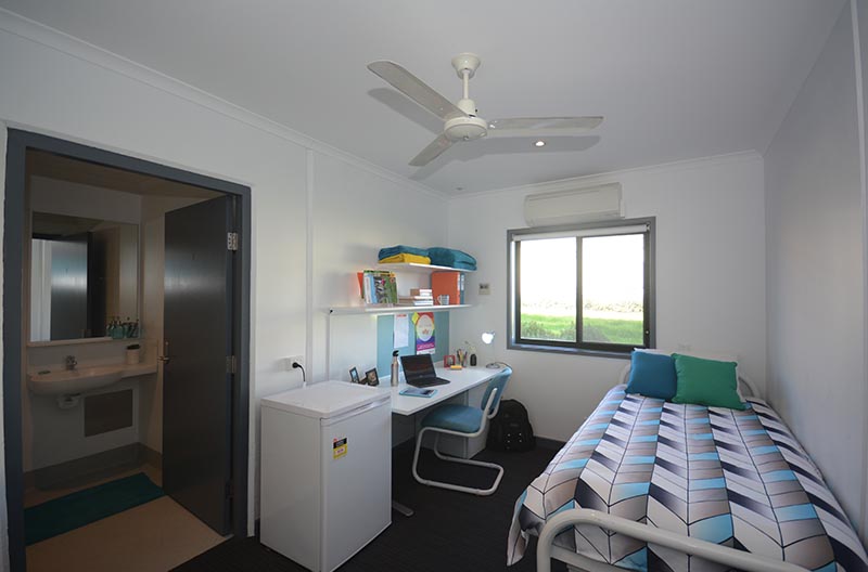 Wide view of room showing sleeping and study areas with ensuite to the side