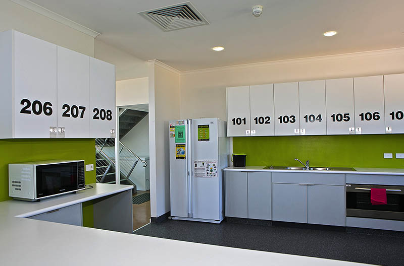 Kitchen area showing numbered cupboards