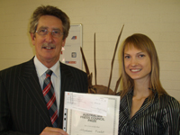Head of the CSU School of Communication, Associate Professor Rod McCulloch, presents a cheque and certificate on behalf of the Australian Press Council to CSU journalism student Ms Stephanie Boulet.