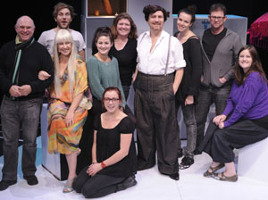 The cast and crew of The Unspeakable Itch; Kate Smith in blonde wig, Romy Clugson kneeling, and Rebecca Keros behind her in green jumper.