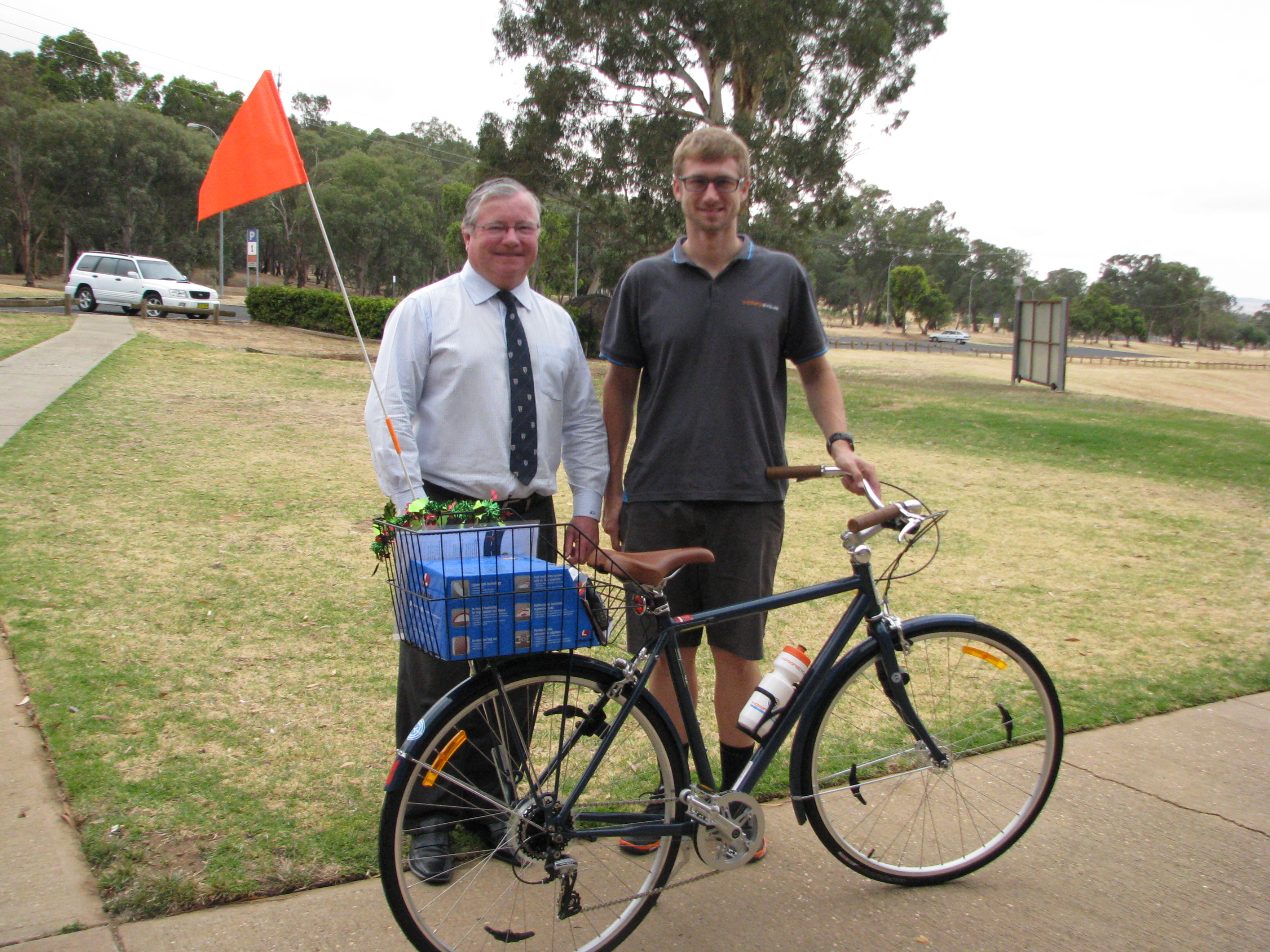 CSU Deputy Vice-Chancellor (Administration) Professor Ken Dillon with Mr Kris Whybro of Kidsons Cycles.