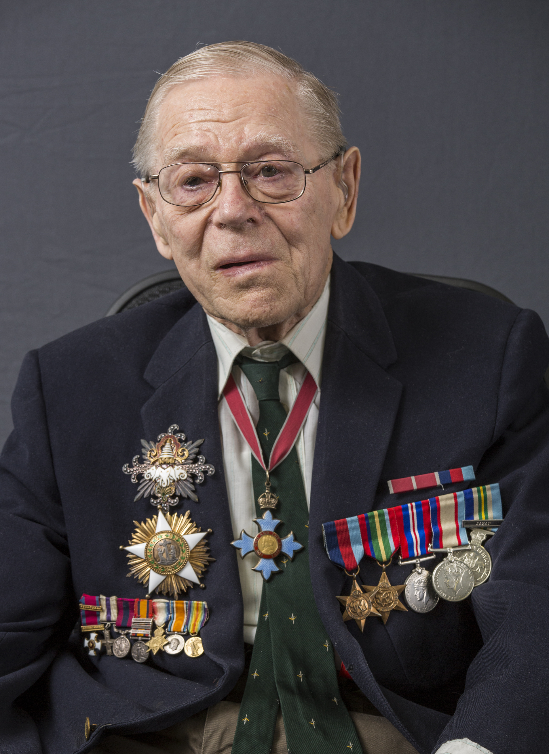 Barrie Dexter wearing awards and medals