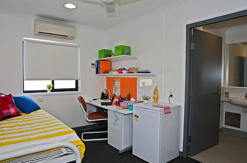View of room showing sleeping and study areas and ensuite