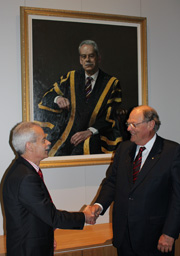 Chancellor Lawrie Willett, AO, unveils the official portrait of Vice-Chancellor Ian Goulter by internationally renowned artist Jaiwei Shen at a meeting of the Council in Bathurst today.
