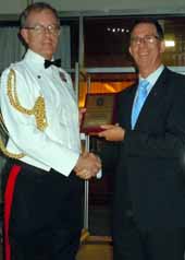 Head of the Cadet, Reserve and Employer Support Division, Major General PL Brereton presenting the NSW Employer Support Award 2011 to the Head of Campus at CSU in Wagga Wagga, Mr Adrian Lindner.
