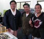 Harmony Day at CSU in Wagga Wagga: the Uniting Church's Mr Daniel Hyun Yang (left) talks with CSU students Mr Kim Jaebong and Mr Yujong Para.