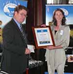 NAB General Manager of Agribusiness, Mr Khan Horne presents CSU student Ms Katherine Snell with the 2012 Greenham Dairy Scholarship.