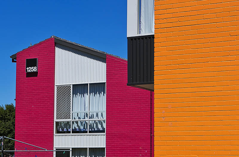 Exterior view of the brightly coloured buildings