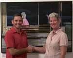 Head of the CSU School of Visual and Performing Arts and judge of the 2009 Casella Art Prize, Associate Professor Margaret Woodward and artist Mr Warren Lane in front of his winning painting The Accidental Activist.