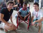 CSU pharmacy students Sam Ledger (left) and Mr Lloyd Smith spent time with children with disabilities at a school in Sri Sangwan in Thailand.