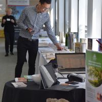 An attendee persuses the books at the Little Lost Bookshop stall. Photograph by Sarah Stitt