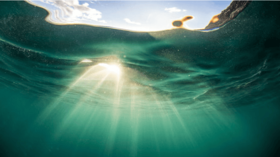 Contemplation and action photo showing light shining through clear water