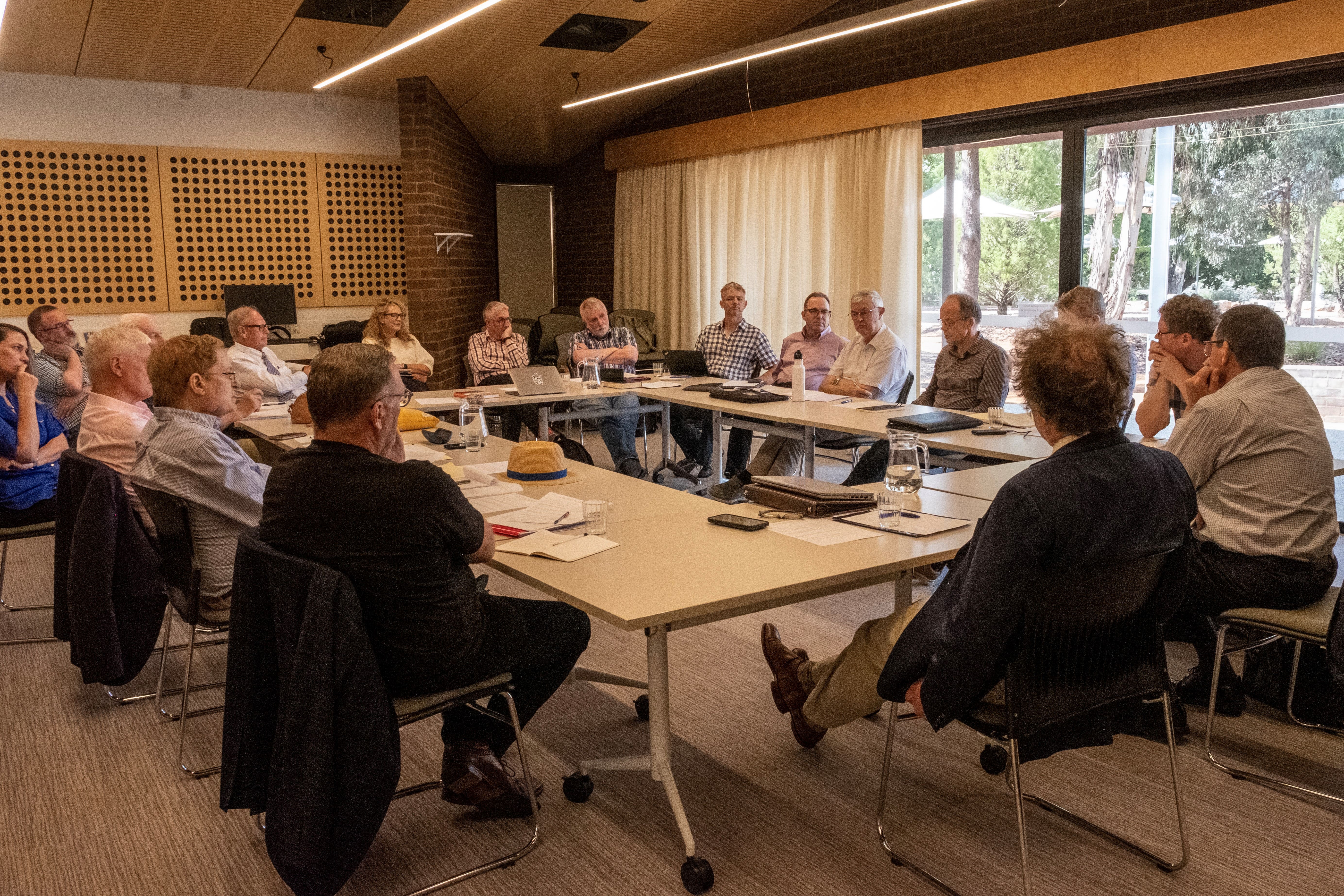 Photo of 2026 HG Brennan workshop participants around a large table
