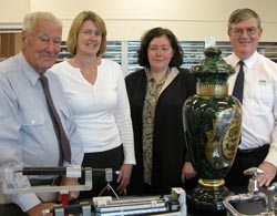 Left to right: Carboy donor Max McCarthy, CSU&rsquo;s Dr Debbie Burton and Heather Robson and current owner of McCarthy Pharmacy Malcolm Rosborough with the donated jar.