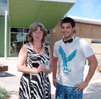 Student services manager Ms Vicki Pitcher presents an iPod to winning student Ben Southi.