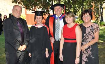 Graduate Ms Ashleigh Brooks with her family and CSU's Dr Bill Anscombe (third left).