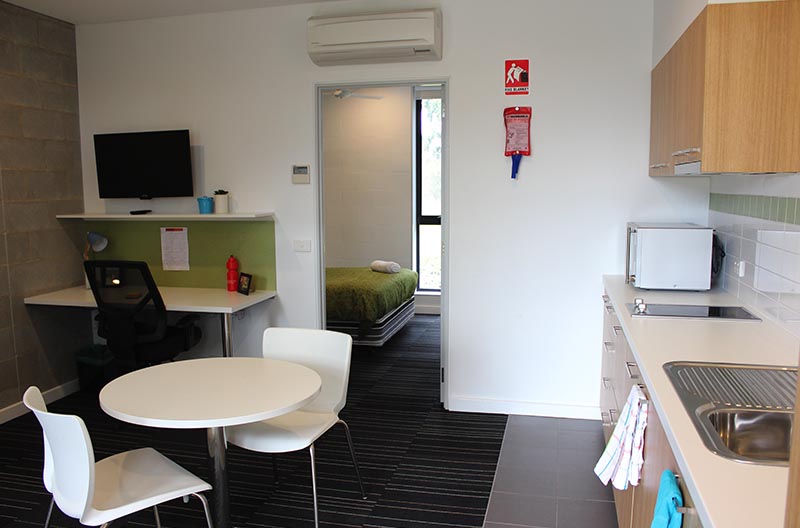 Wide view showing kitchen, lounge and study areas, through to the sleeping space