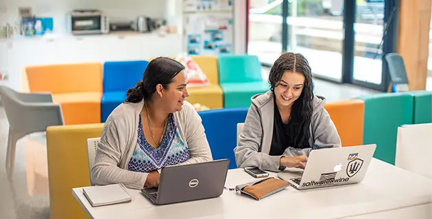 Two First Nations students studying