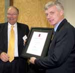Jurox Research and Development Head, Dr Ted Whittem, (left) was presented with a certificate for early support of the veterinary science program at CSU. He is pictured with CSU Chancellor Laurie Willett AO. 