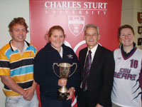 CSU Vice-Chancellor Professor Ian Goulter congratulates CSU students Charlie Nordfeldt (rugby), Eliza Baddock (women's touch football), and Samantha Gaal (women's basketball).