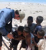Dr Rik Thwaites with East Timorese children.