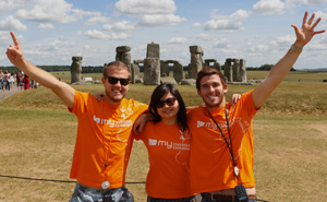 Mr Angus Rutherford (right) visits Stonehenge with friends on his recent trip to the UK.