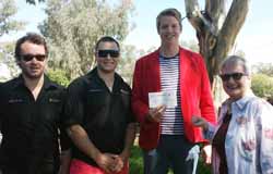 From left: Residential Advisors Jeremy Callan and Patrick McNamara hand over the cheque to Daniel Hayes with Head of Campus Miriam Dayhew.