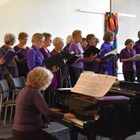 A Chorus of Women performed at the Welcome Reception. Photograph by Katherine Waite