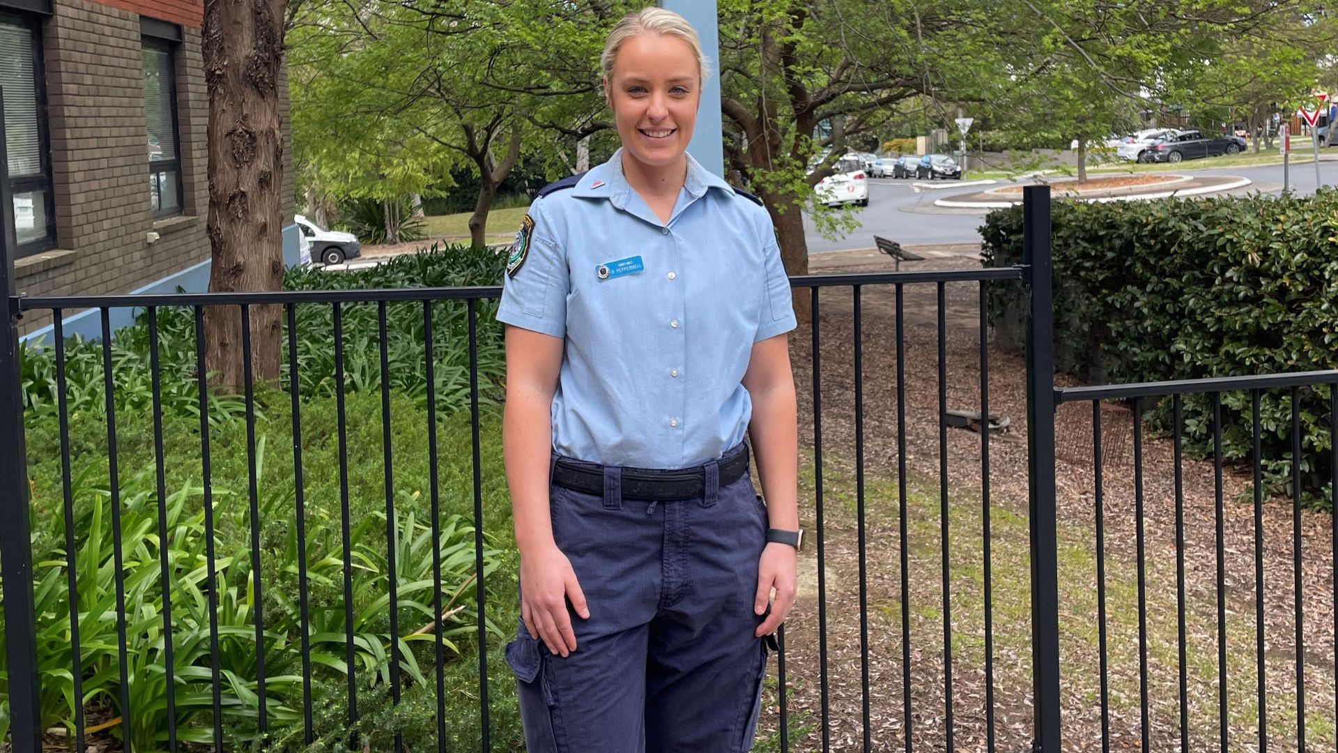 Graduate flying flag for inclusivity in NSW Police Force 