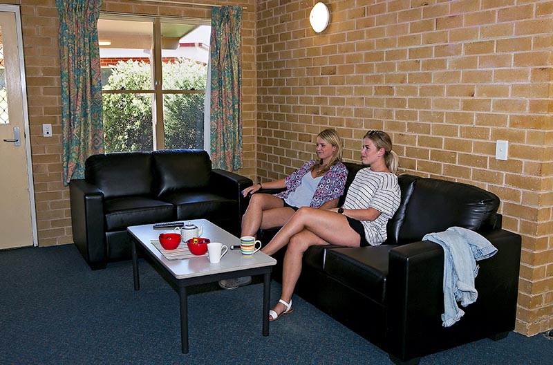 Students in the lounge area of a cottage