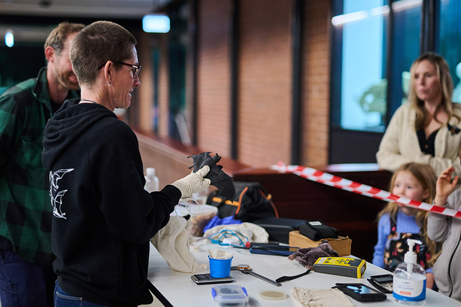 Guest speakers provide mock demonstrations of monitoring and capturing techniques for bats used by Ecologists