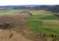 Aerial shot of Peter Andrews’ work next to untouched neighbour’s property. Photo courtesy of Australian Story on ABC TV.