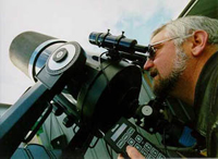 CSU's Associate Professor David McKinnon and telescope