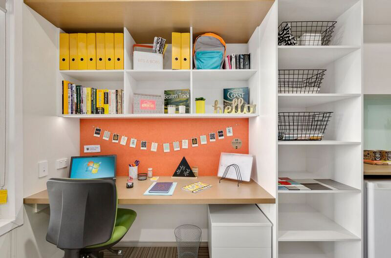 View of study space, including desk and storage