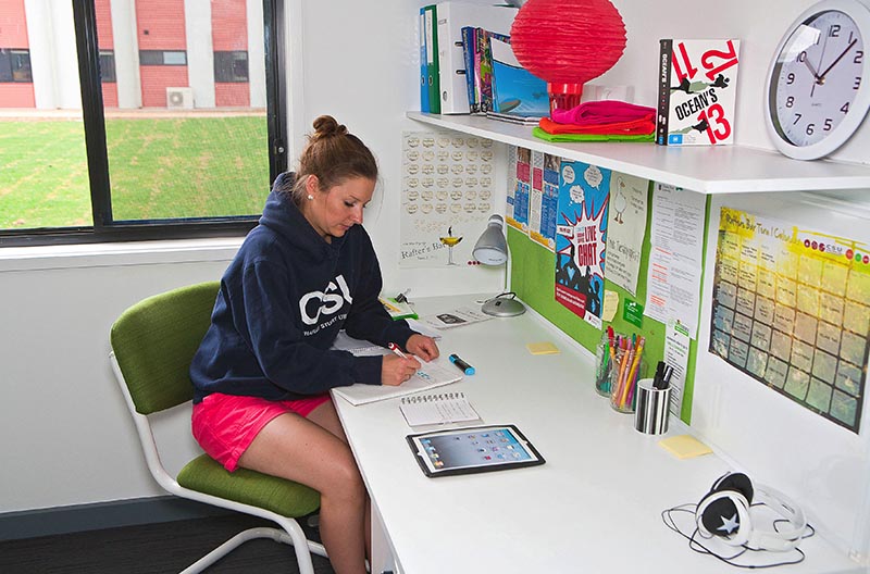 Student at her desk in her room