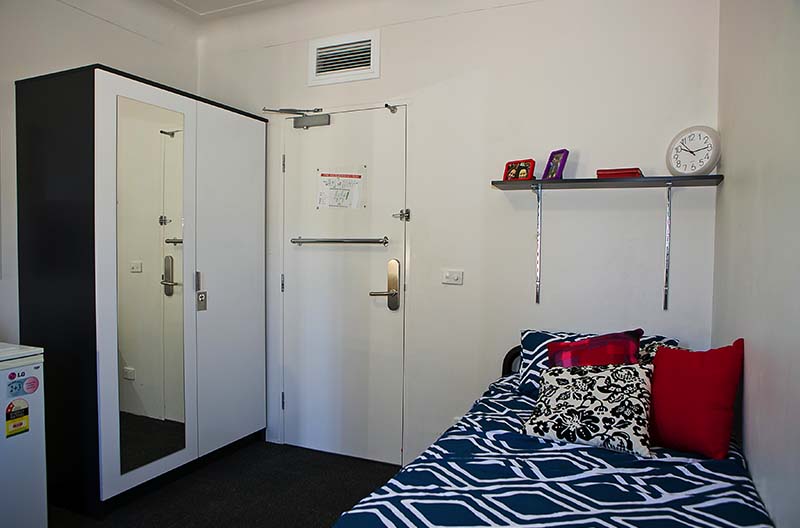 A view showing sleeping area and wardrobe spaces