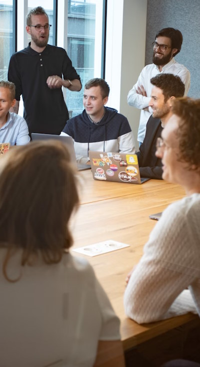 A group of men collaborating on an office project.