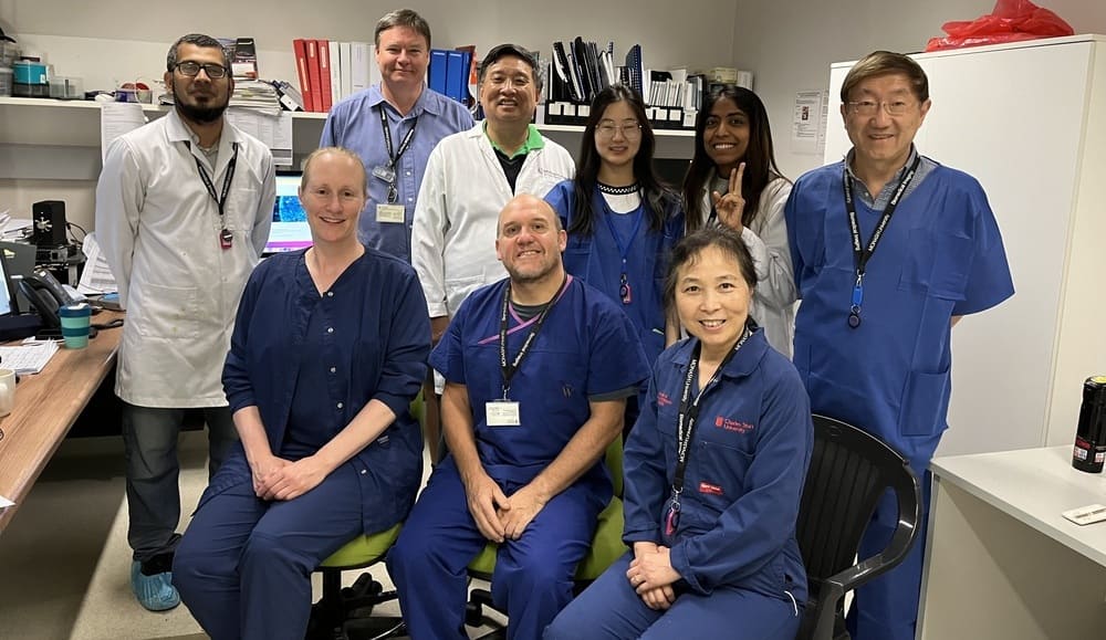 Research team sitting together at Monash University