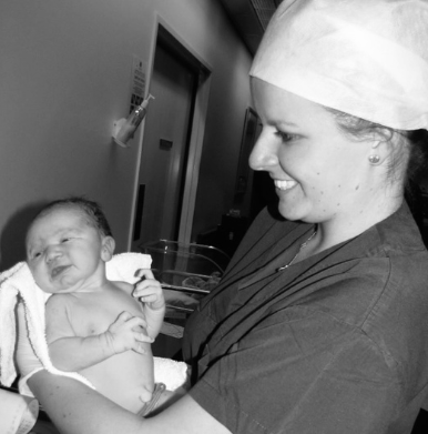 Torie Finnane holding a baby