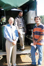 Professor Paul Burnett, Dr Asitha Katupitiya and CSU Irrigation Initiative Scholarship winner, Richard Burbury, check CSU's new mobile irrigation research facility.